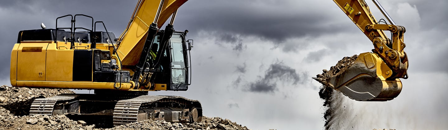 Excavator at contruction site in need of waste removal