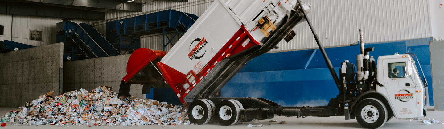Recycling Truck Dumping Recyclables at Material Recovery Facility