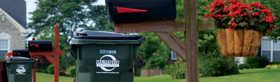 Recycling bins outside of homes in a neighborhood
