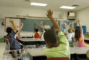 Rumpke recycling education for kids raising hands in classroom