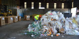 Rumpke Employee Looking Through Business Waste