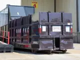 Rumpke Commercial Trash Compactor At A Commercial Facility