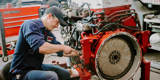 Rumpke Mechanic Working On Machine For Hydraulic Repair Service