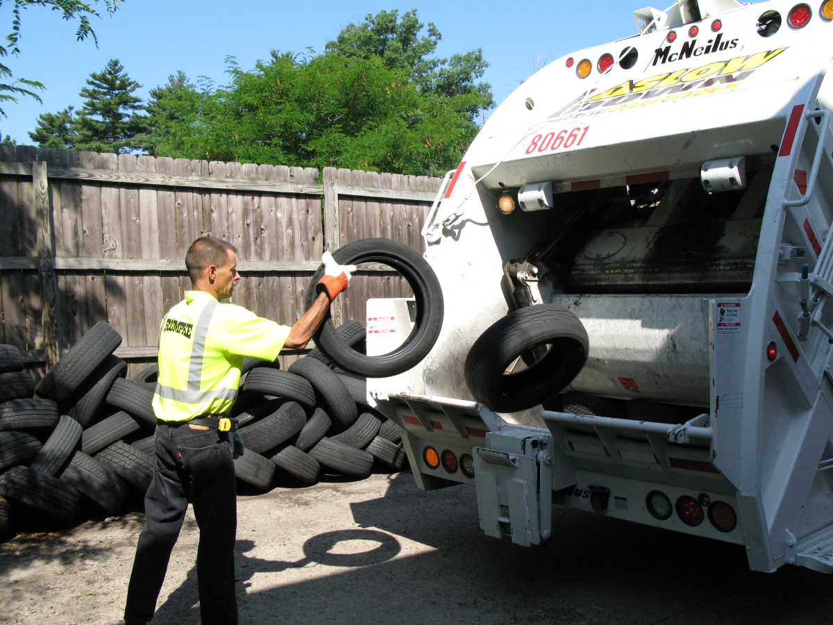 Rumpke Driver Throwing Tires Into Recycling Truck