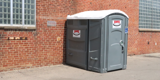 ADA Compliant Portable Restroom With Rumpke Signage