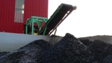 Tire Recycling Conveyor Belt With Piles Of Shredded Tires