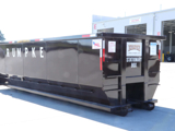 Rumpke Commercial Roll Off Dumpster At Local Tire Shop